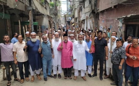 চাঁদাবাজির প্রতিবাদে ব্যবসায়ীদের লাঠি মিছিল